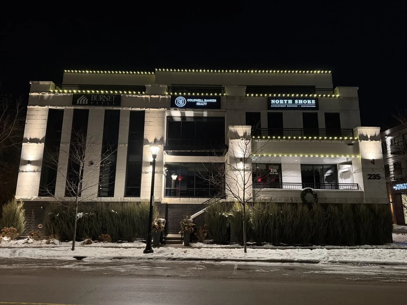 Commercial holiday lighting on the North Shore Development Partners office building — FCR Cleaning
