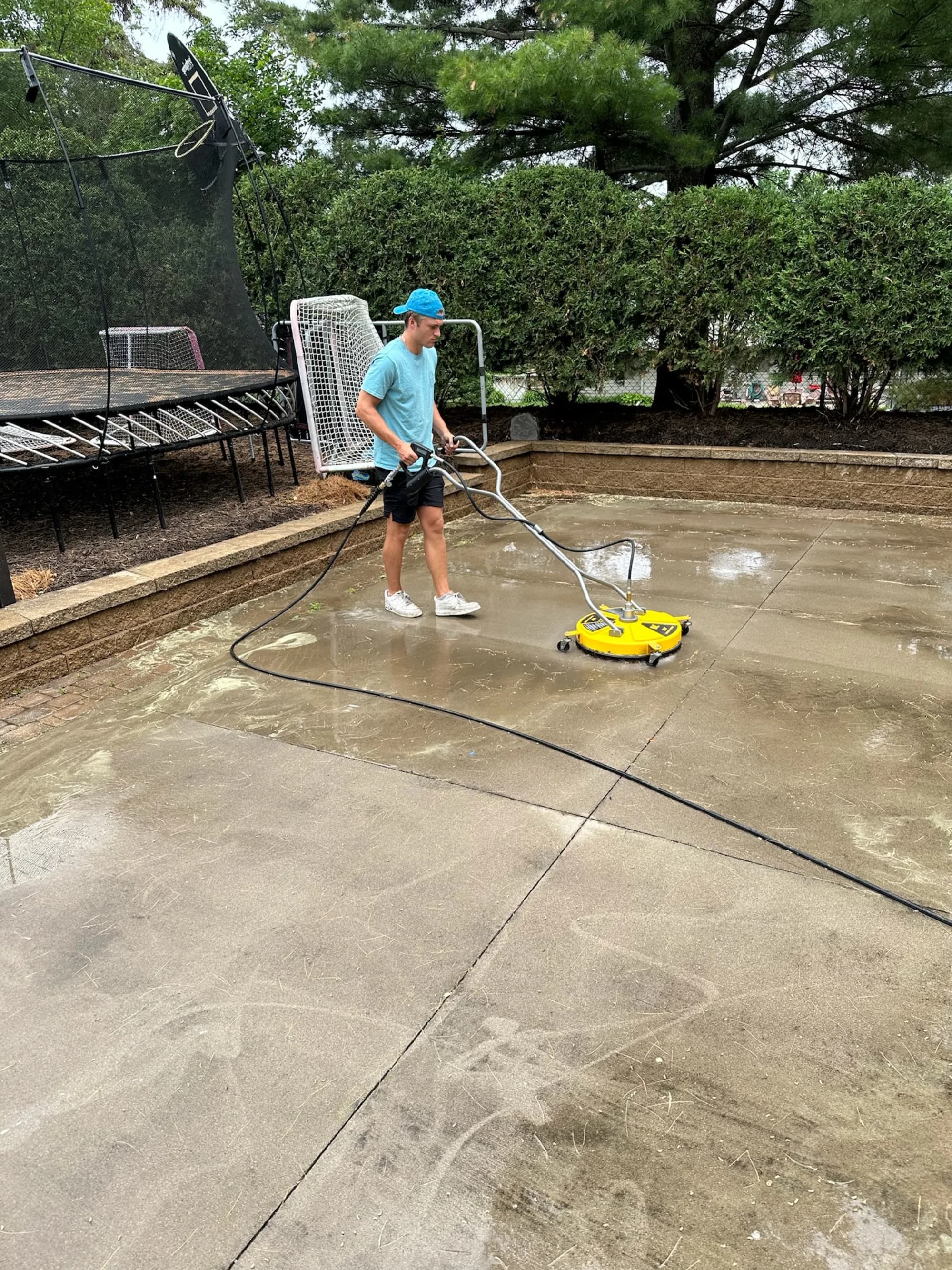FCR Cleaning pressure washing a backyard sport court with a rotary surface cleaner — Twin Cities MN