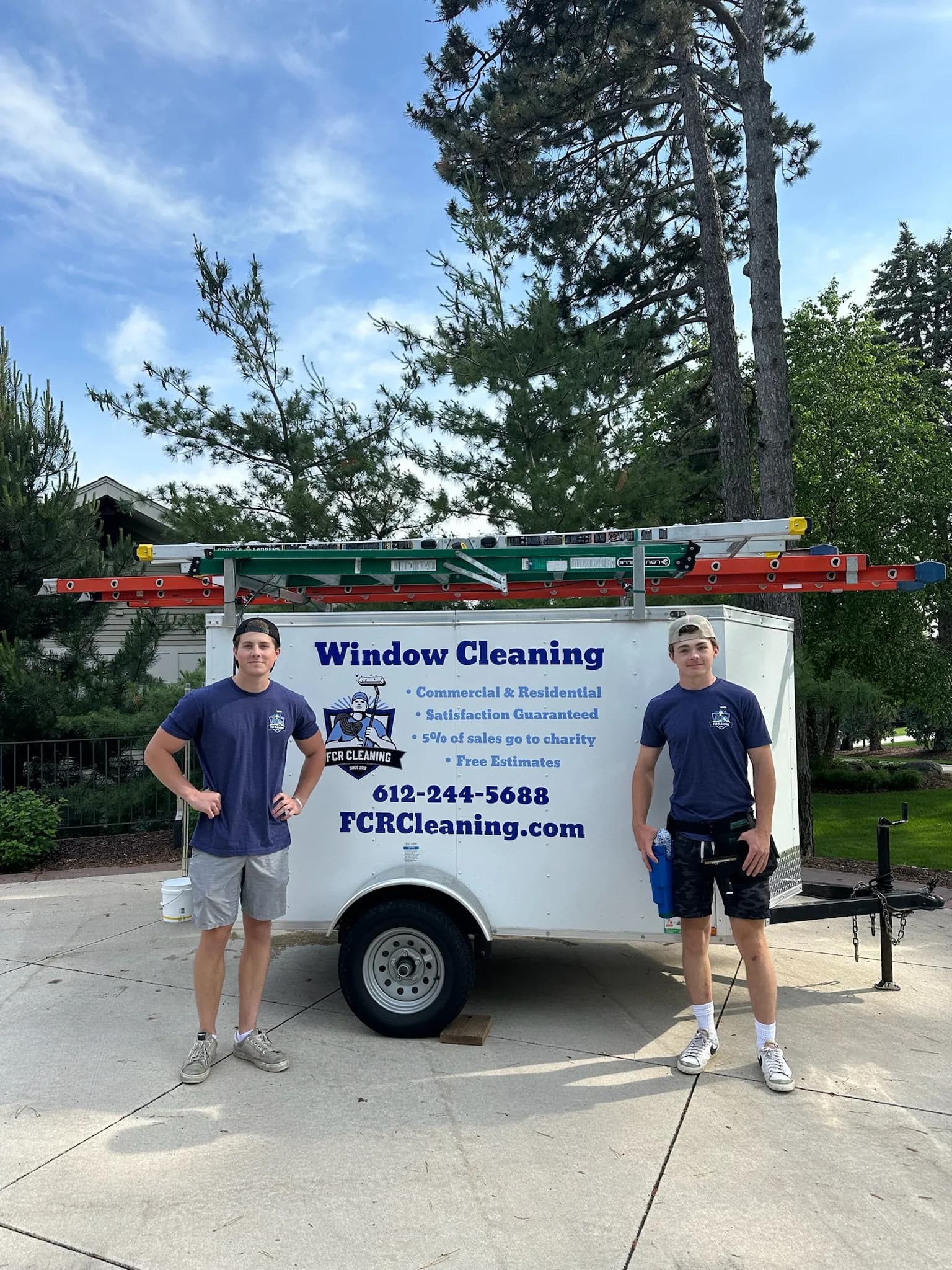 FCR Cleaning branded trailer with two crew members