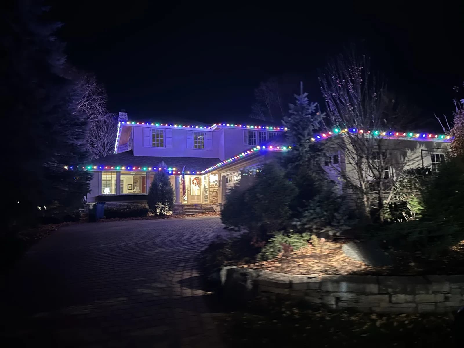Multicolored C9 roofline design across every peak and gutter line of a two-story home