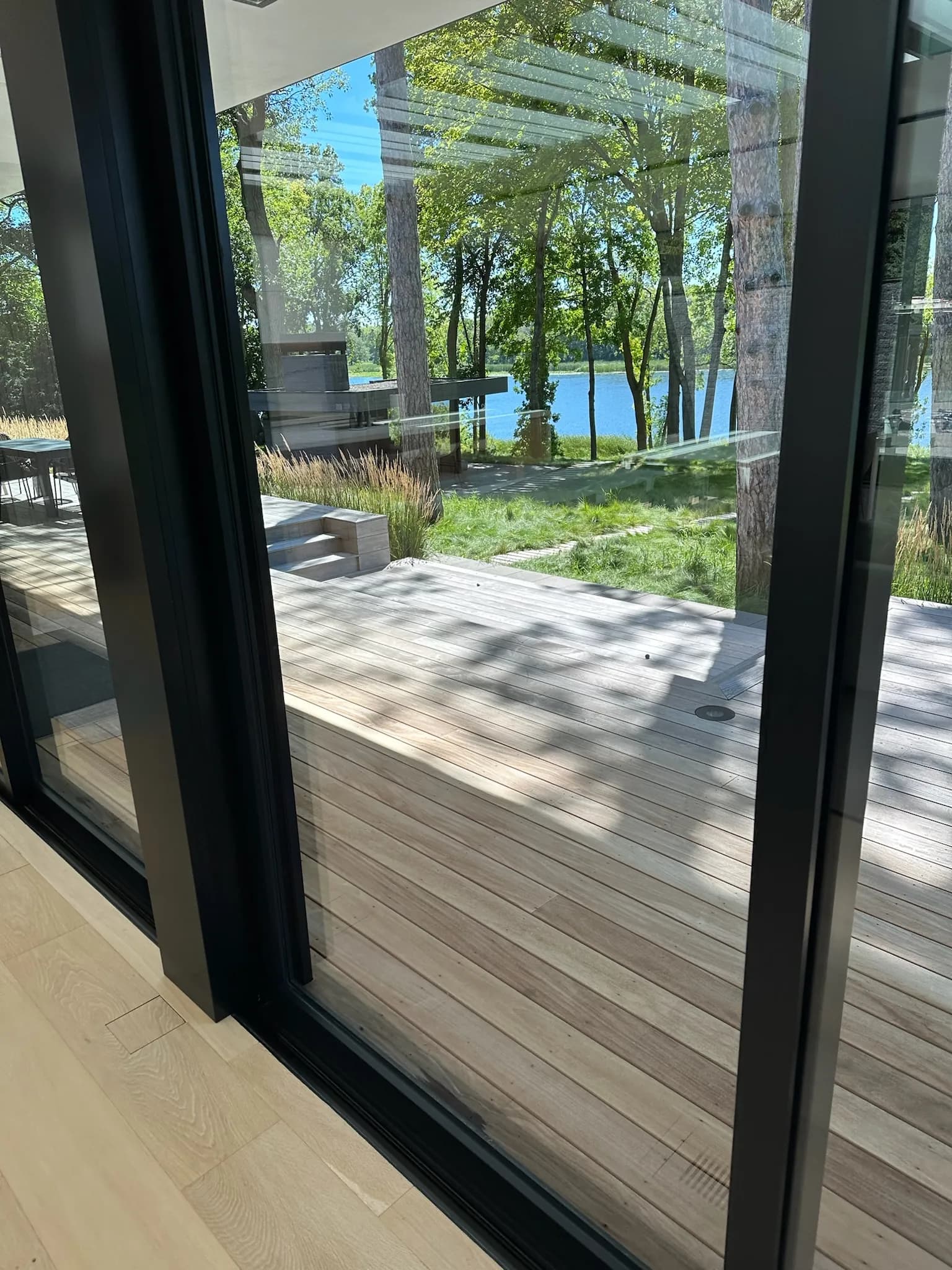 Streak-free sliding glass doors with a clear lake view — window cleaning results Twin Cities MN