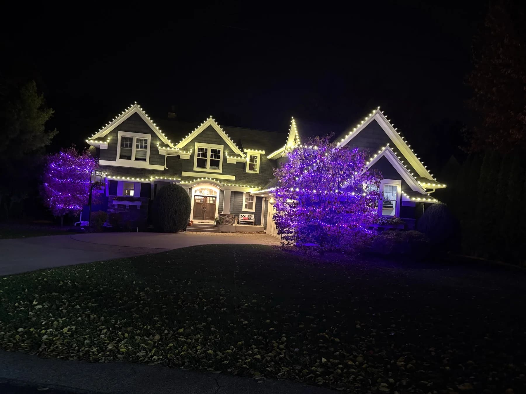 Custom color roofline lighting installed by FCR — commercial holiday lighting Twin Cities