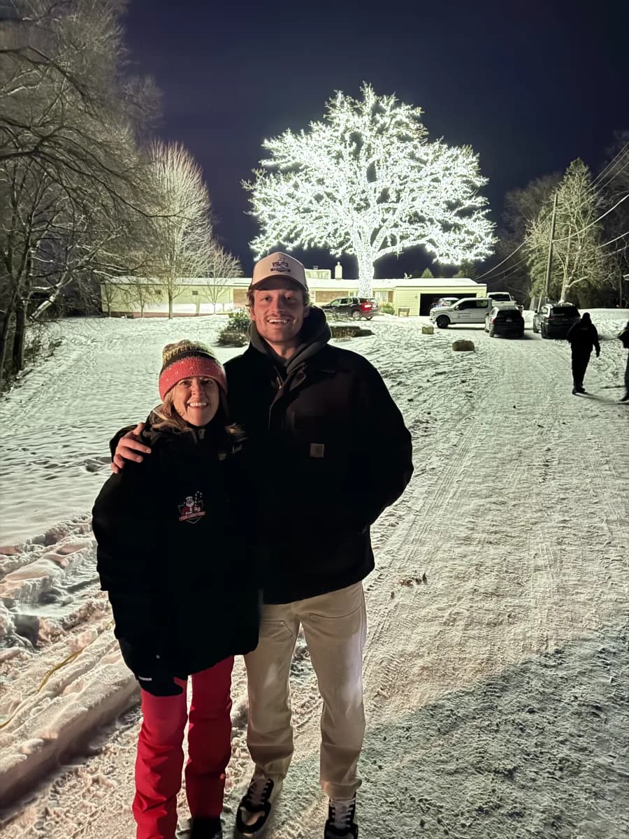 Fritz and his mom in front of the Lighted Oak — FCR Cleaning holiday lighting Excelsior MN